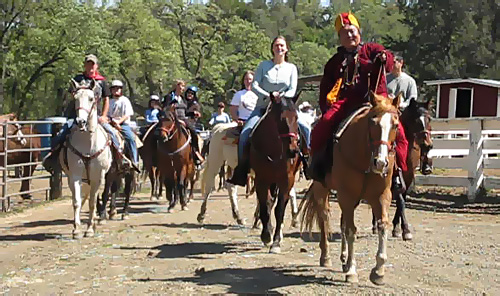 Dzogchen Khenpo Choga Rinpoche riding a horse