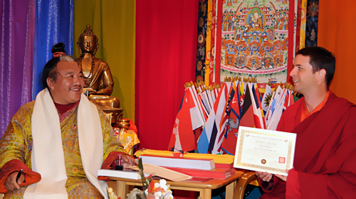 Dzogchen Khenpo Choga Rinpoche presenting Kunzang with a certificate authorizing him to teach Buddhadharma in the tradition of the Dzogchen Lineage.